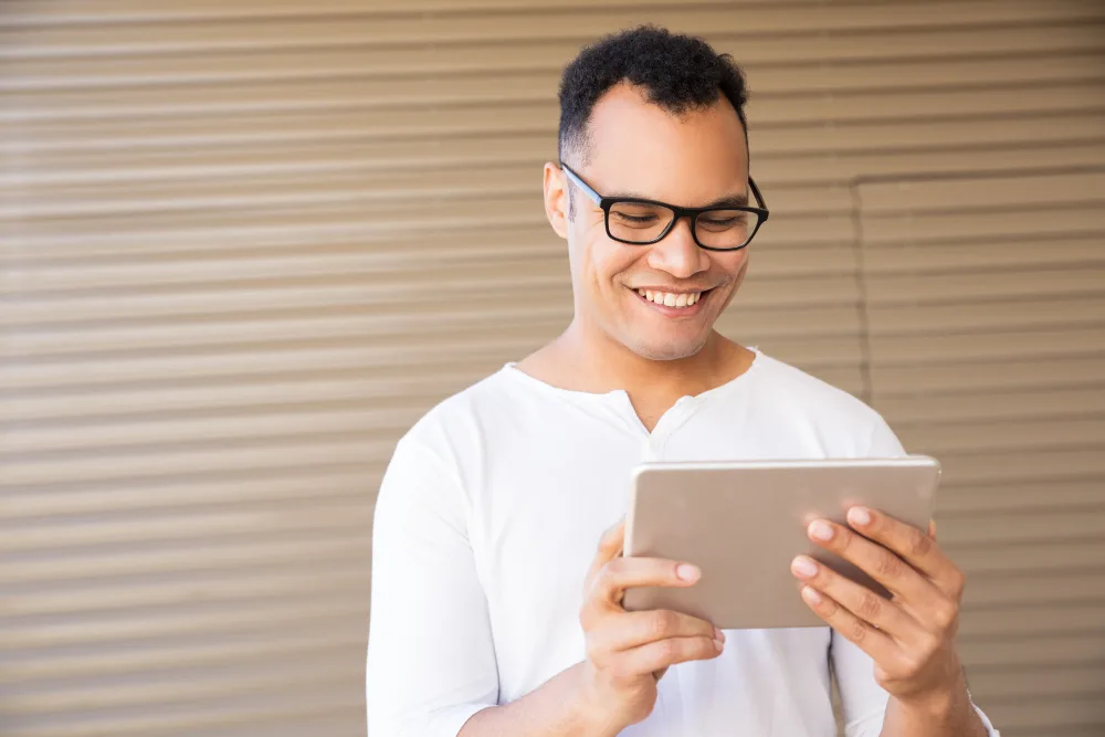 Business owner reviewing a monthly marketing report on a tablet
